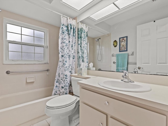 full bathroom with tile patterned flooring, vanity, shower / tub combo, and toilet