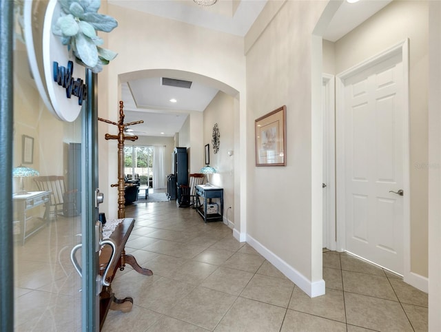 foyer featuring light tile patterned flooring