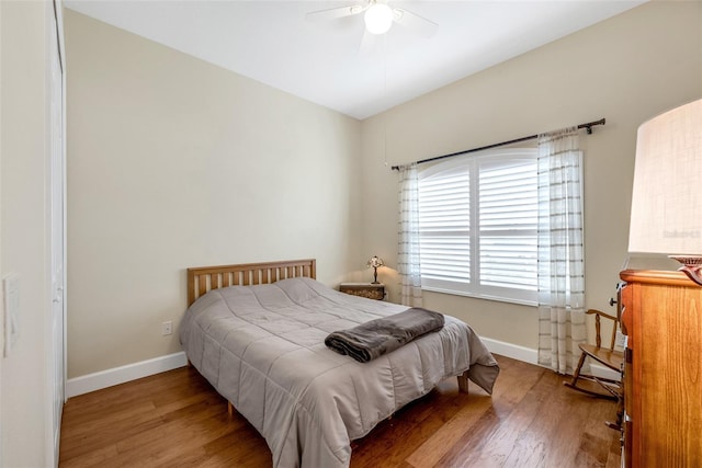 bedroom featuring wood-type flooring and ceiling fan