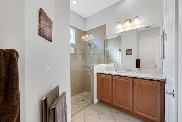 bathroom with radiator, tile patterned flooring, walk in shower, and vanity