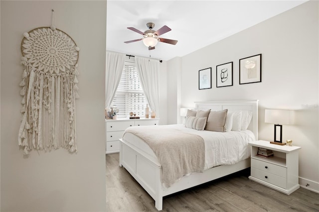 bedroom featuring ceiling fan and hardwood / wood-style floors