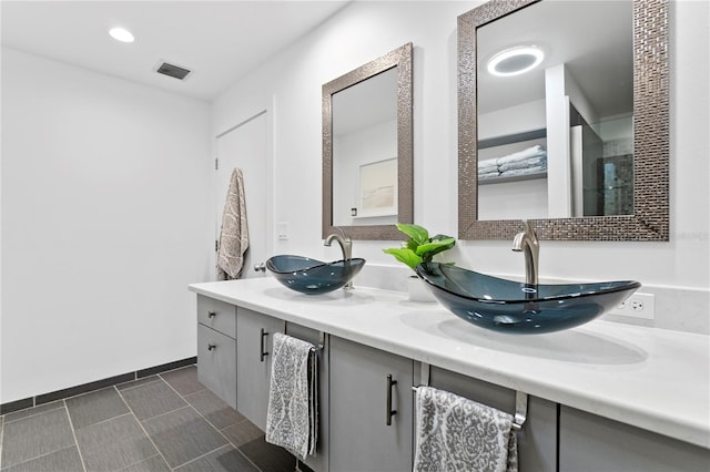 bathroom with tile patterned flooring and vanity