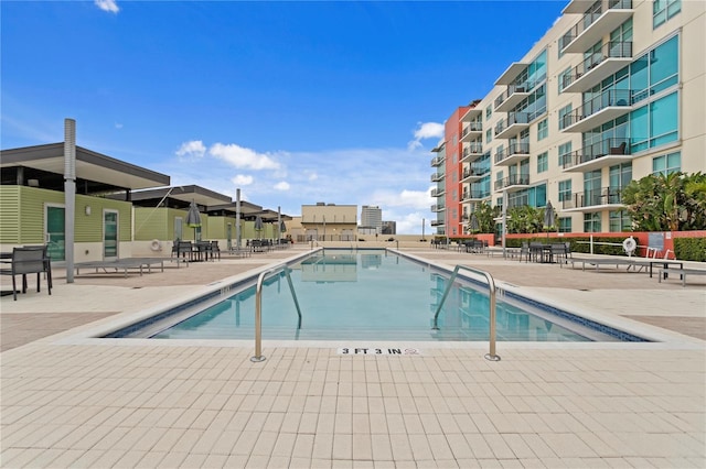 view of swimming pool featuring a patio area