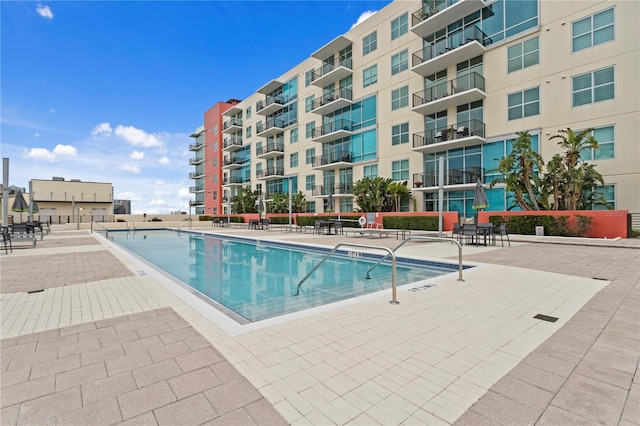 view of swimming pool with a patio