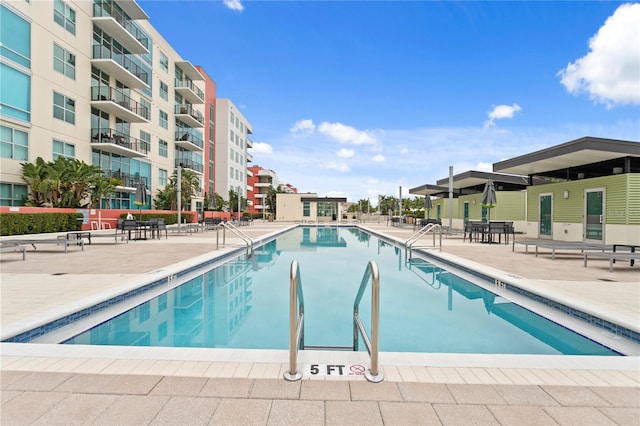 view of pool featuring a patio