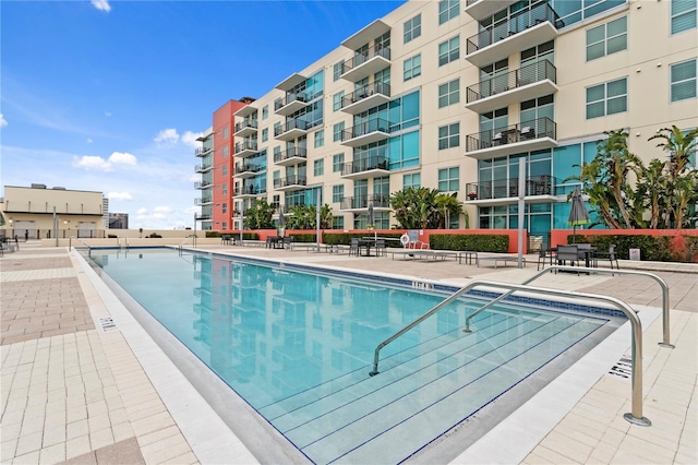 view of swimming pool with a patio