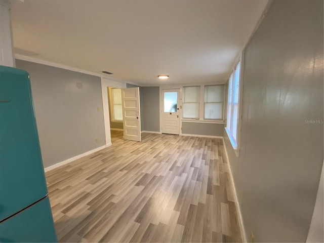 interior space featuring light hardwood / wood-style flooring and refrigerator