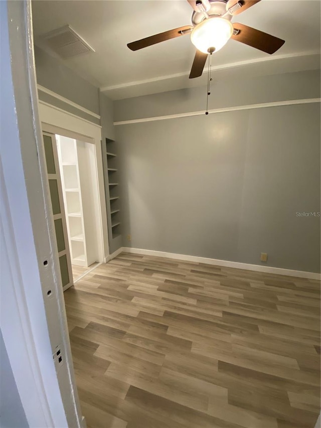 empty room with hardwood / wood-style flooring