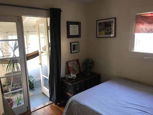 bedroom with hardwood / wood-style floors