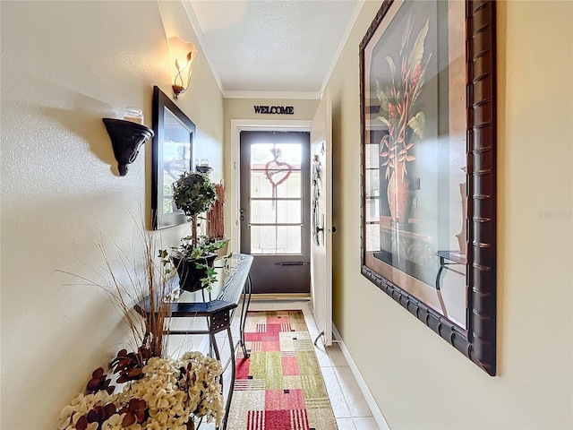 entryway with a textured ceiling, light tile patterned floors, and ornamental molding