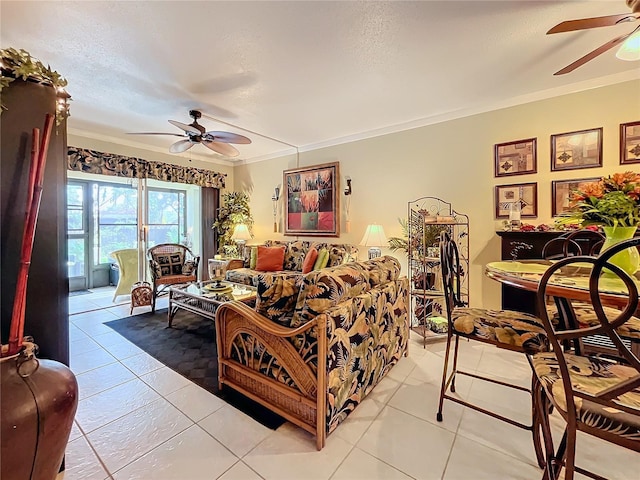 living room featuring a textured ceiling, light tile patterned floors, ceiling fan, and ornamental molding