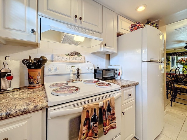 kitchen with light stone counters, white cabinets, white electric range oven, and light tile patterned flooring