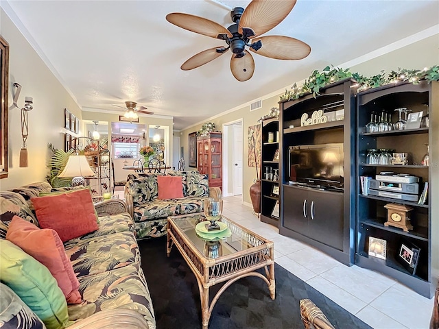 living room with ceiling fan, crown molding, and light tile patterned flooring