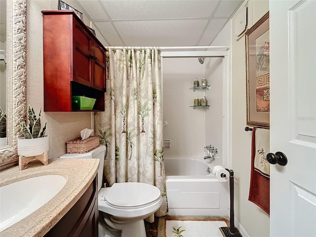 full bathroom featuring vanity, toilet, a paneled ceiling, and shower / tub combo