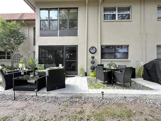 rear view of house with a patio and an outdoor hangout area