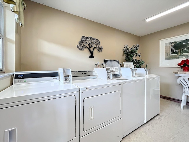 washroom featuring washing machine and clothes dryer