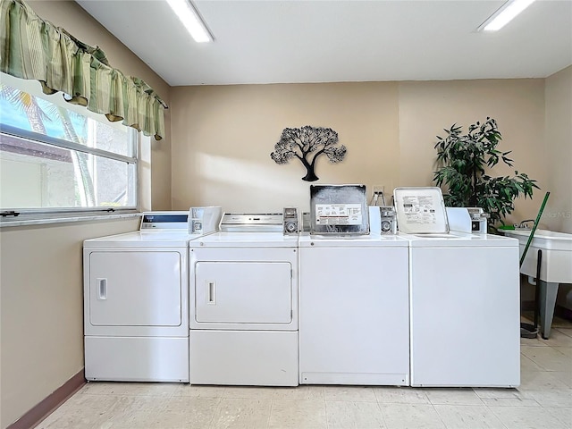 washroom with washing machine and clothes dryer