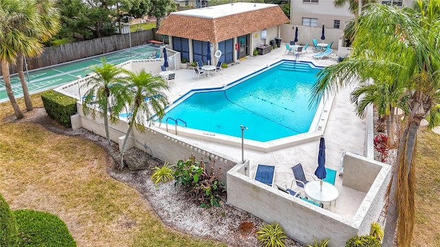 view of pool featuring a patio area and an outdoor structure