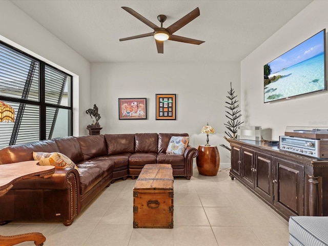 living room featuring light tile patterned flooring and ceiling fan