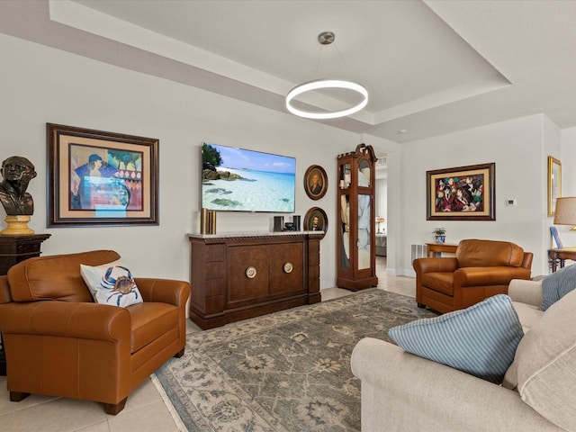 tiled living room with a raised ceiling