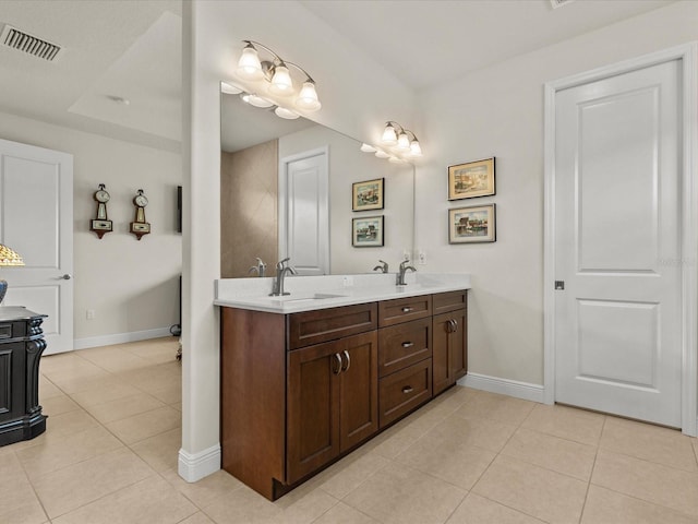 bathroom with vanity and tile patterned floors