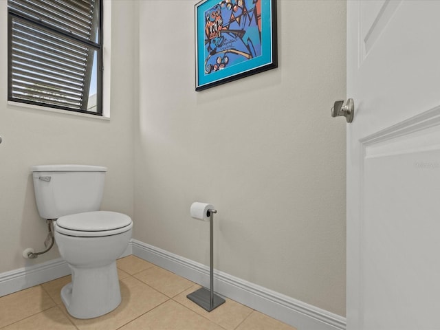 bathroom with tile patterned flooring and toilet