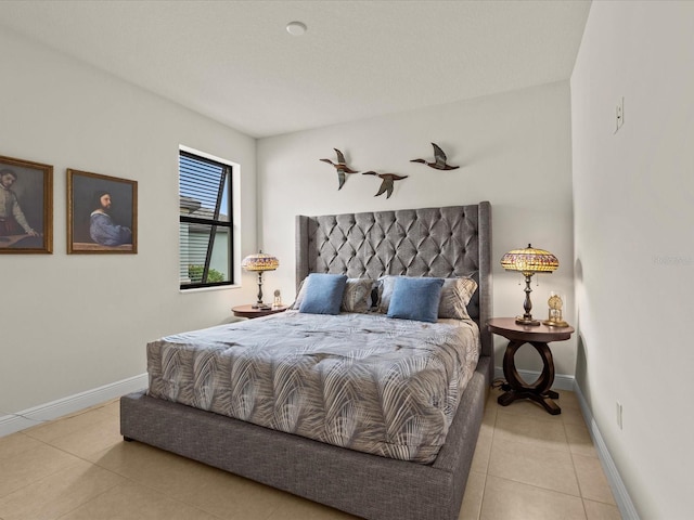 bedroom with light tile patterned flooring