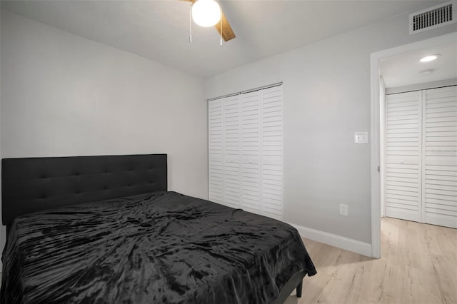 bedroom with ceiling fan and light hardwood / wood-style floors