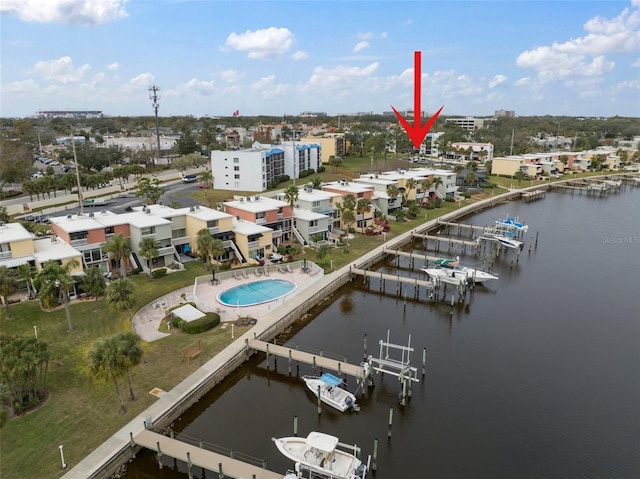 birds eye view of property with a water view