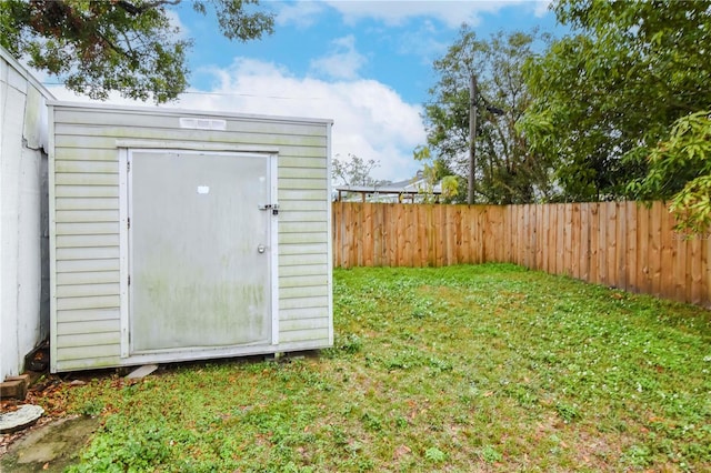 view of outdoor structure with a lawn