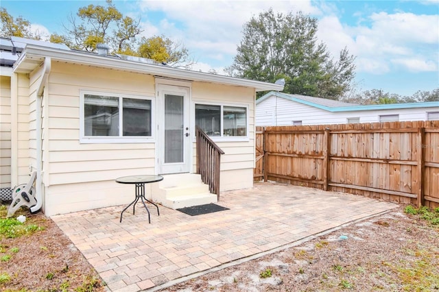 back of property featuring a patio