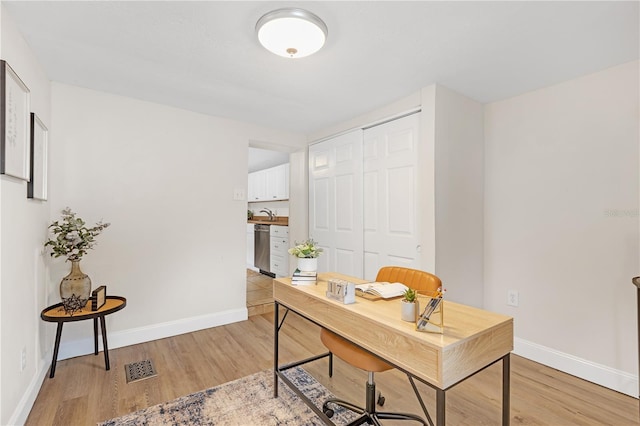 office space featuring light hardwood / wood-style flooring