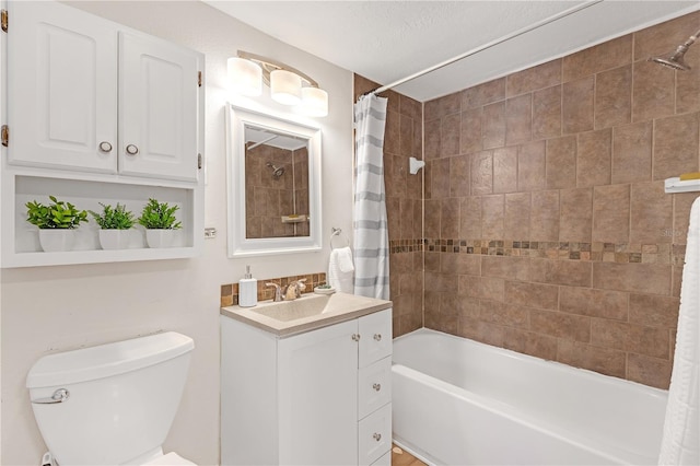 full bathroom featuring toilet, vanity, shower / tub combo, and a textured ceiling