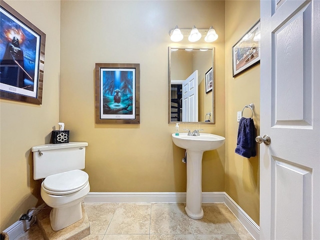 bathroom featuring tile patterned floors and toilet