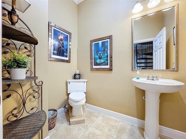 bathroom with tile patterned floors and toilet