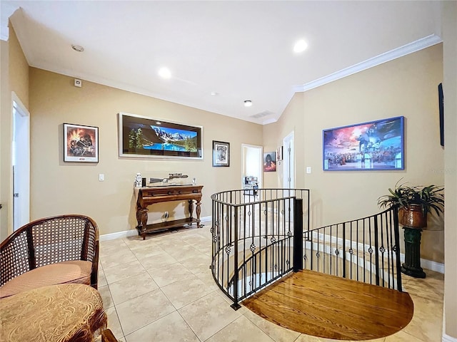 hallway featuring light tile patterned floors and ornamental molding