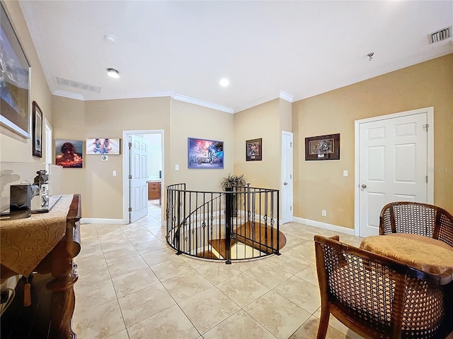 hall with light tile patterned floors and crown molding