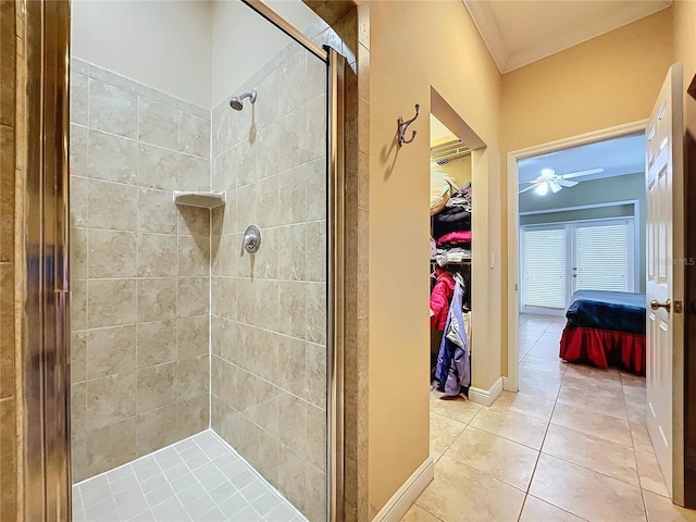 bathroom featuring ceiling fan, tile patterned floors, and walk in shower