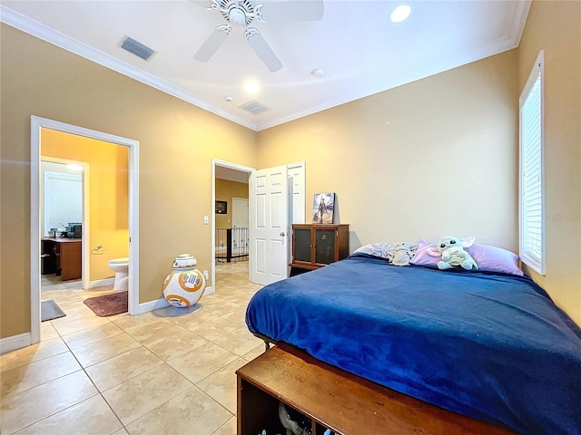 tiled bedroom with ceiling fan, ensuite bath, and crown molding