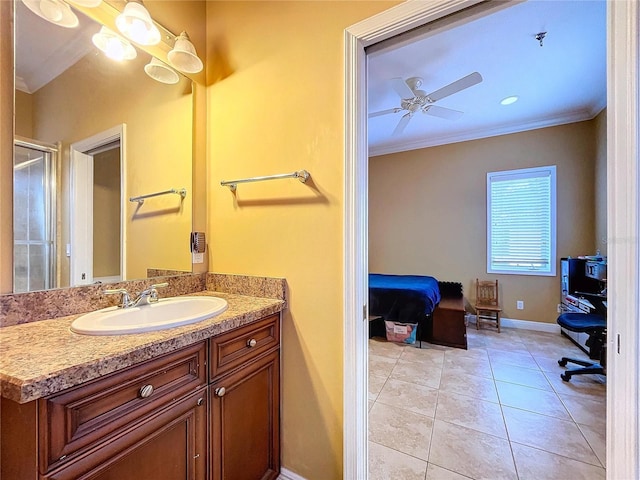 bathroom with ceiling fan, vanity, tile patterned flooring, walk in shower, and crown molding