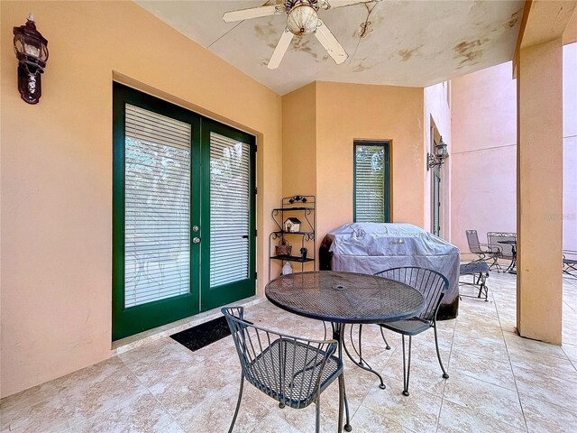 view of patio / terrace featuring grilling area, ceiling fan, and french doors