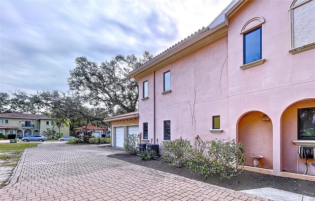 view of side of home with a garage