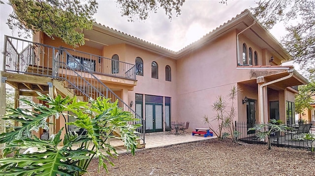 rear view of house featuring a patio