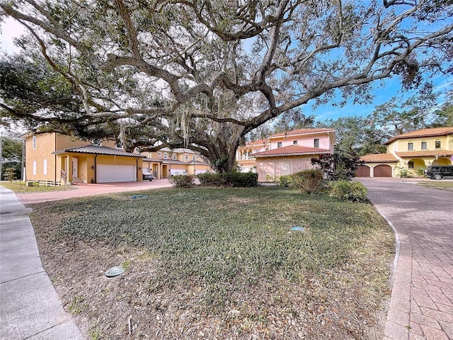 view of front of house featuring a front yard and a garage