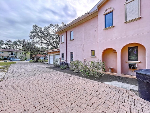 view of property exterior featuring a garage