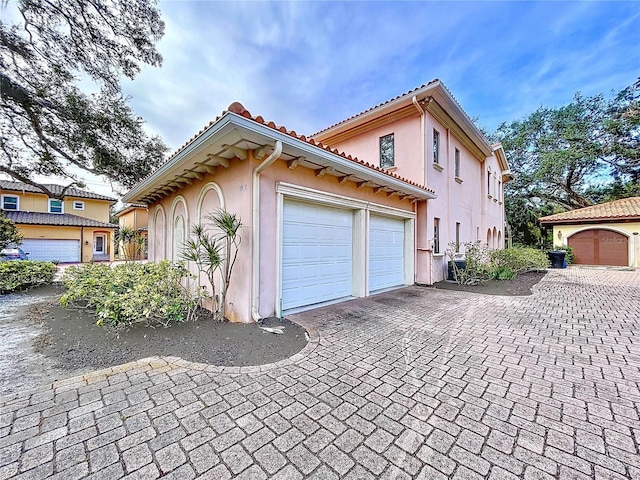 view of property exterior featuring a garage