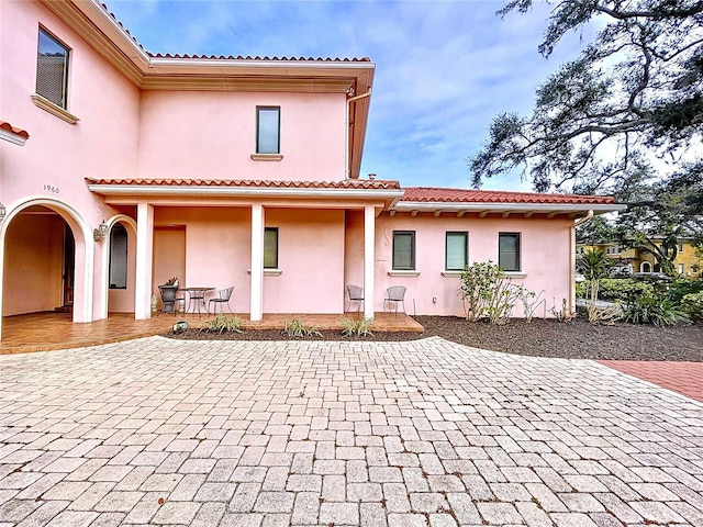 rear view of house with a patio