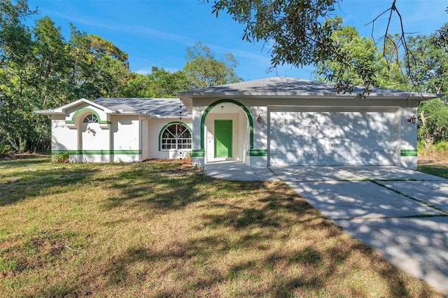 ranch-style home featuring a front lawn and a garage