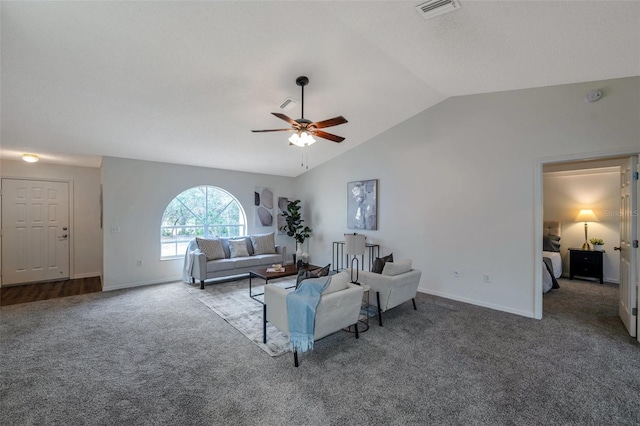 living room featuring lofted ceiling, ceiling fan, and carpet floors