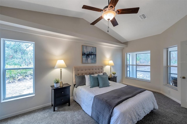 carpeted bedroom featuring ceiling fan and vaulted ceiling